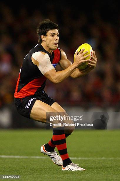 Angus Monfries of the Bombers gathers the ball during the round seven AFL match between the Essendon Bombers and the West Coast Eagles at Etihad...