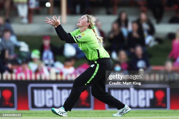 Sammy-Jo Johnson of the Thunder takes a catch to dismiss Suzie Bates of the Sixers during the Women's Big Bash League match between the Sydney Sixers...