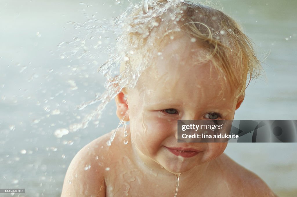 Water falling on baby boy