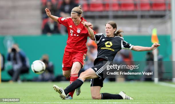 Kerstin Garefrekes of Frankfurt and Katharina Baunach of Bayern battle for the ball during the DFB Women's Cup final match between 1. FFC Frankfurt...