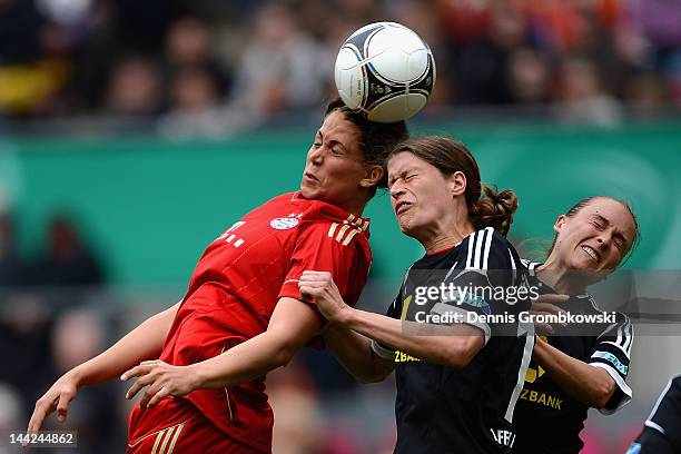 Sarah Hagen of Muenchen misses a chance at goal under the pressure of Kerstin Garefrekes of Frankfurt during the Women's DFB Cup Final between 1. FFC...