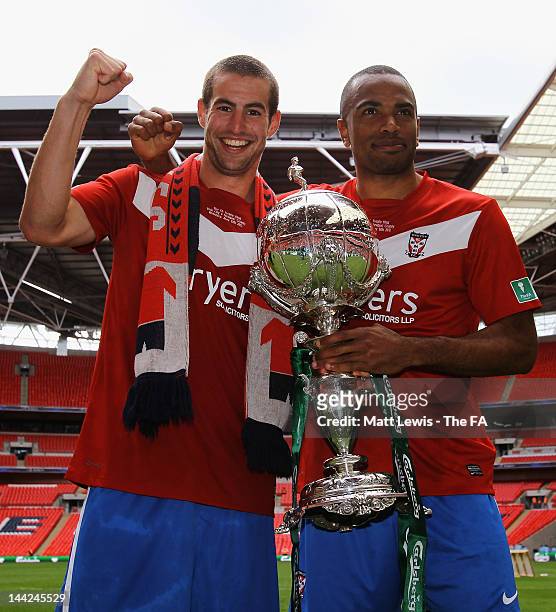 Matty Blair and Lanre Oyebanjo of York celebrate with the FA Trophy, after their team beat Newport County during the FA Trophy Final match between...