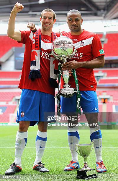 Matty Blair and Lanre Oyebanjo of York celebrate with the FA Trophy, after their team beat Newport County during the FA Trophy Final match between...