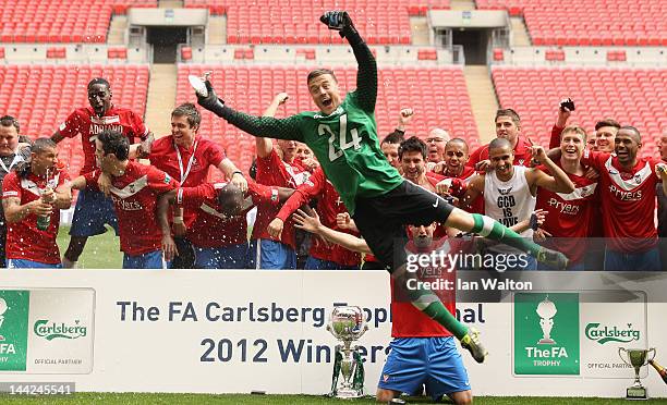 York City players celebrates with the trophy after winning the FA Trophy Final match between York City and Newport County at Wembley Stadium on May...