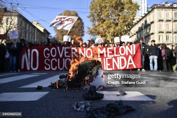 Students burn a box with writings protesting against Prime Minister of Italy Giorgia Meloni and Confindustria during the Student's March Against...