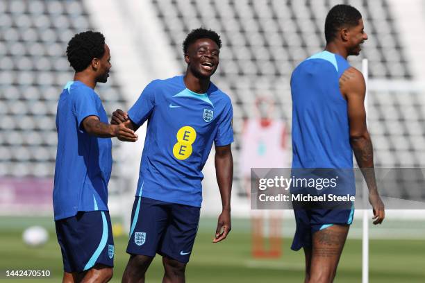 Bukayo Saka alongside Raheem Stirling and Marcus Rashford during the England Training Session at Al Wakrah Stadium on November 18, 2022 in Doha,...