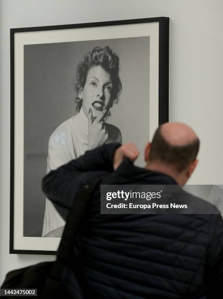 Man looks at a photograph in the exhibition 'Steven Meisel 1993 A Year in Photographs' at the Muelle de la Bateria in A Coruña, on 18 November, 2022...
