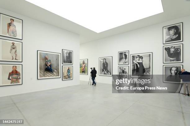 Two men at the exhibition 'Steven Meisel 1993 A Year in Photographs' at the Muelle de la Bateria in A Coruña, on 18 November, 2022 in A Coruña,...