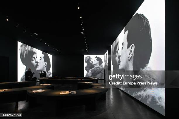 Several people look at the projections on the walls of the exhibition 'Steven Meisel 1993 A Year in Photographs' at the Muelle de la Bateria in A...
