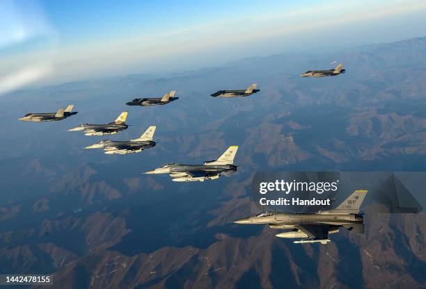 In this handout image released by the South Korean Defense Ministry, South Korean Air Force F-35 fighter jets and U.S. Air Force F-16 fighter jets...