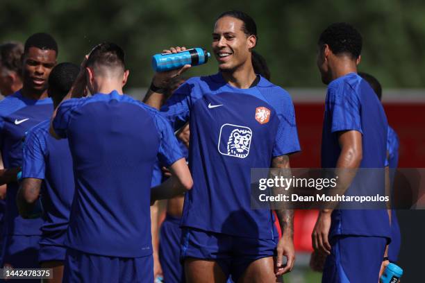 Virgil Van Dijk of Netherlands smiles during the Netherlands Training Session at Qatar University training complex on November 18, 2022 in Doha,...