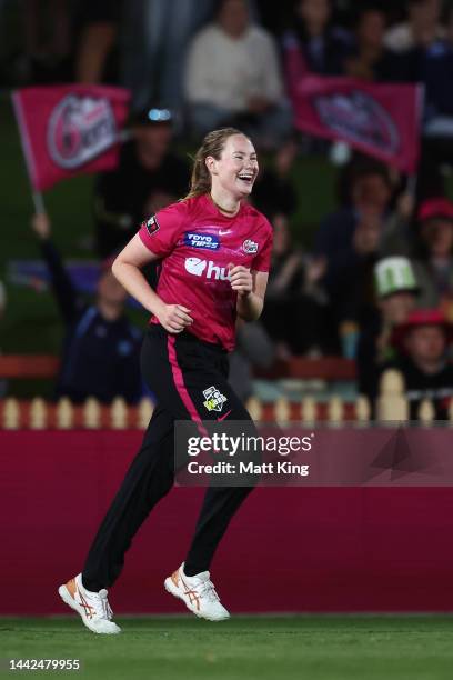 Lauren Cheatle of the Sixers celebrates Chloe Tryon of the Thunder taking a catch to dismiss during the Women's Big Bash League match between the...