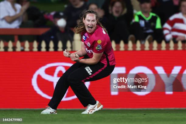 Lauren Cheatle of the Sixers celebrates Chloe Tryon of the Thunder taking a catch to dismiss during the Women's Big Bash League match between the...