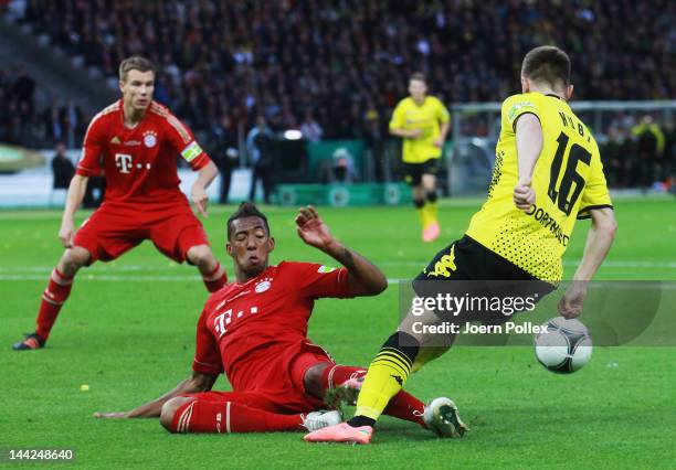 Jakub Blaszczykowski of Dortmund is fouled by Jerome Boateng of Muenchen during the DFB Cup final match between Borussia Dortmund and FC Bayern...