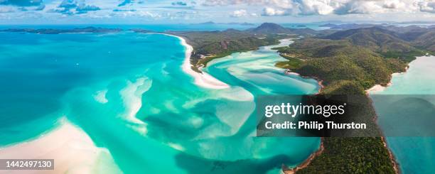 panorama of hill inlet on a sunny day in whitsundays island in great barrier reef, australia - australasia stock pictures, royalty-free photos & images