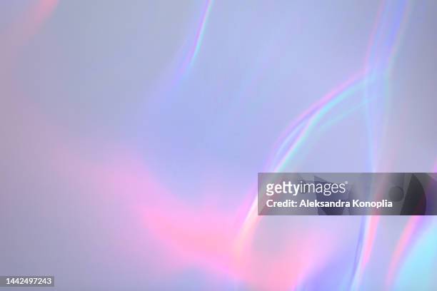 surreal aura rainbow laser light refraction texture overlay effect on white wall - shiny surface stock pictures, royalty-free photos & images