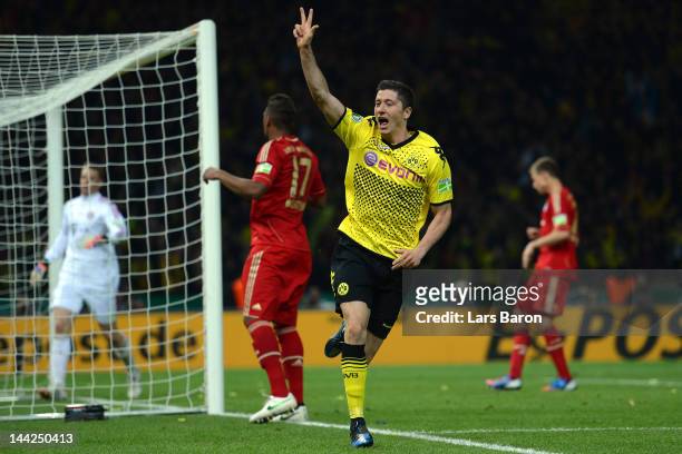Robert Lewandowski of Dortmund celebrates after scoring his third and his teams fives goal during the DFB Cup final match between Borussia Dortmund...