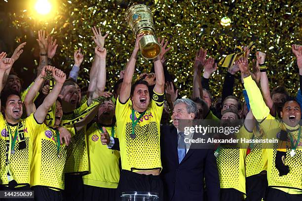 Sebastian Kehl of Dortmund celebrates with his team mates and Joachim Gauck, federal president of Germany winning the DFB Cup final match between...