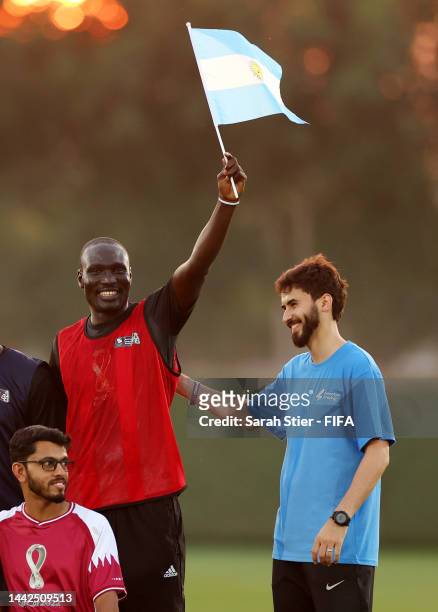 Participants and member of Argentina coaching staff interact during the Argentina Community Engagement Event at Qatar University Training Site 3 on...
