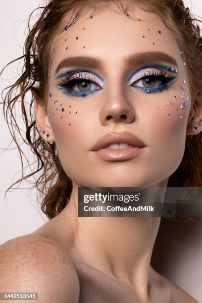 beautiful woman with bright make-up - glitter face stock pictures, royalty-free photos & images