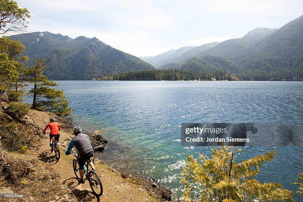 A man a woman bike riding.