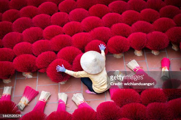 drying incense stick in vietnam - hanoi stockfoto's en -beelden