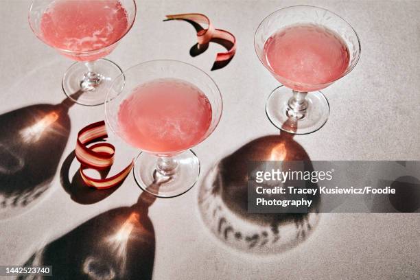 rhubarb sparkling mocktail-retouch - pink champagne stock pictures, royalty-free photos & images