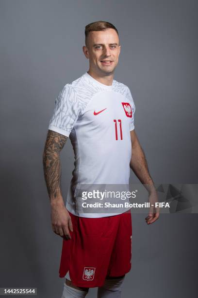 Kamil Grosicki of Poland poses during the official FIFA World Cup Qatar 2022 portrait session on November 18, 2022 in Doha, Qatar.