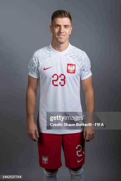 Krzysztof Piatek of Poland poses during the official FIFA World Cup Qatar 2022 portrait session on November 18, 2022 in Doha, Qatar.