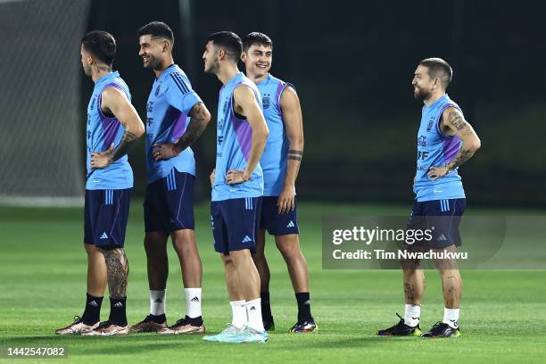 Paulo Dybala of Argentina reacts with teammates during the Argentina Training Session at Qatar University training site 3 on November 18, 2022 in...