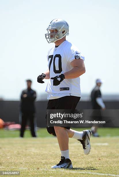 Tony Bergstrom of the Oakland Raiders participates in offensive drills during the Raiders Rookie Minicamp on May 12, 2012 at the Oakland Raiders...