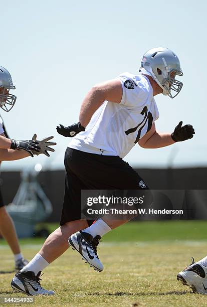 Tony Bergstrom of the Oakland Raiders participates in offensive drills during the Raiders Rookie Minicamp on May 12, 2012 at the Oakland Raiders...