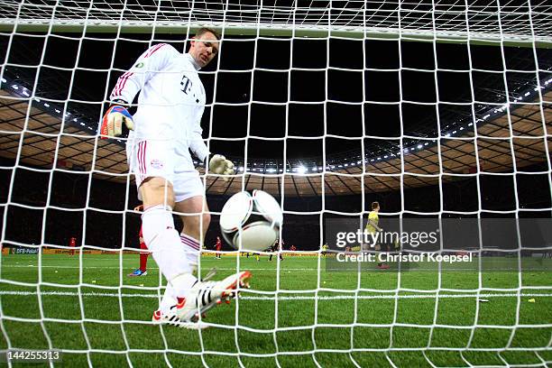 Manuel Neuer of Bayern kicks the ball out of the net after getting the fifth goal during the DFB Cup final match between Borussia Dortmund and FC...