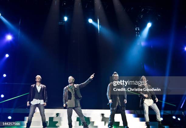 Kian Egan, Shane Filan, Mark Feehily and Nicky Byrne of Westlife perform on stage during the band's farewell tour at O2 Arena on May 12, 2012 in...