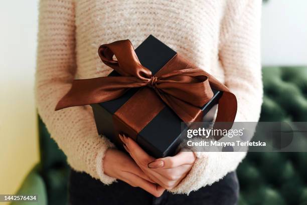 gift box in female hands. new year. christmas. gift. - grant bildbanksfoton och bilder