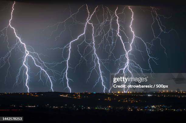 low angle view of lightning in sky at night,drage,croatia - lightning stock pictures, royalty-free photos & images