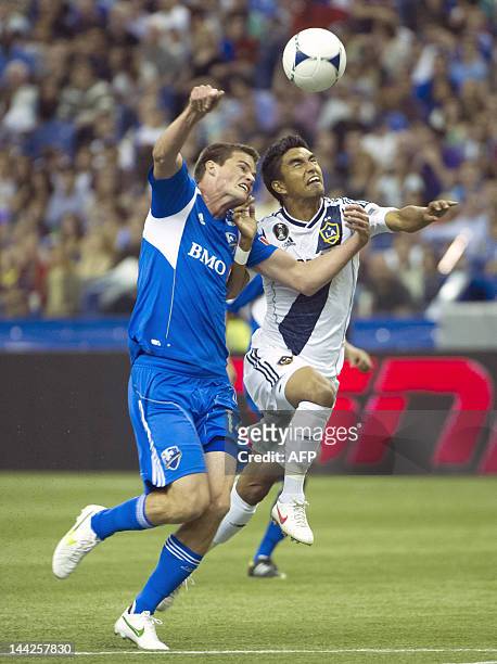 Justin Braun of the Montreal Impact vies with A.J. DeLaGarza of the Los Angeles Galaxy during their match in Montreal on May 12, 2012. AFP...
