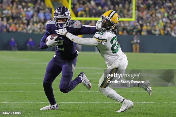 Robert Woods of the Tennessee Titans is pursued by Darnell Savage of the Green Bay Packers during a game at Lambeau Field on November 17, 2022 in...