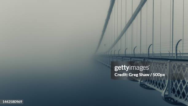 view of suspension bridge over sea,bristol,united kingdom,uk - bridge fog stock pictures, royalty-free photos & images