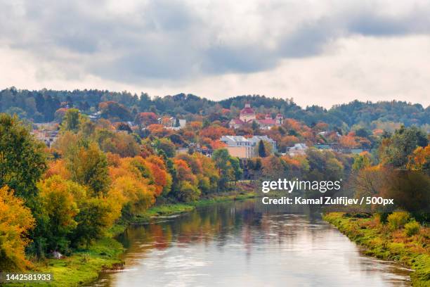 scenic view of lake by trees against sky during autumn,lithuania - lithuania stock pictures, royalty-free photos & images