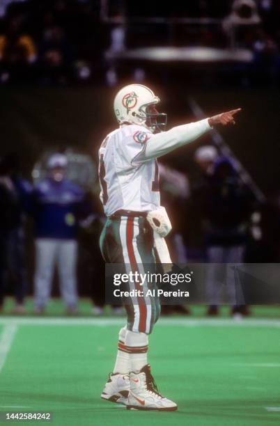 Quarterback Dan Marino of the Miami Dolphins calls a play in the game between the Miami Dolphins vs the New York Jets at The Meadowlands on December...
