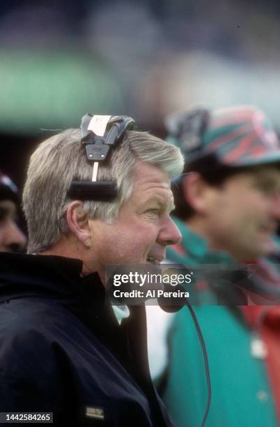 Head Coach Jimmy Johnson of the Miami Dolphins follows the action in the game between the Miami Dolphins vs the New York Jets at The Meadowlands on...