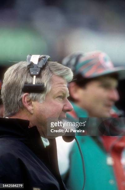 Head Coach Jimmy Johnson of the Miami Dolphins follows the action in the game between the Miami Dolphins vs the New York Jets at The Meadowlands on...