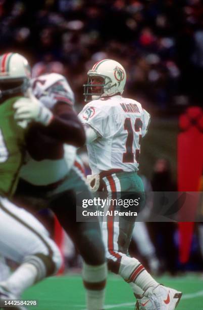 Quarterback Dan Marino of the Miami Dolphins passes the ball in the game between the Miami Dolphins vs the New York Jets at The Meadowlands on...