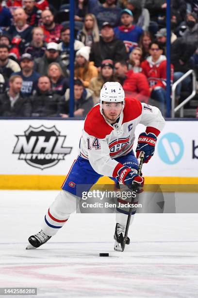 Nick Suzuki of the Montreal Canadiens skates with the puck during the second period of a game against the Columbus Blue Jackets at Nationwide Arena...