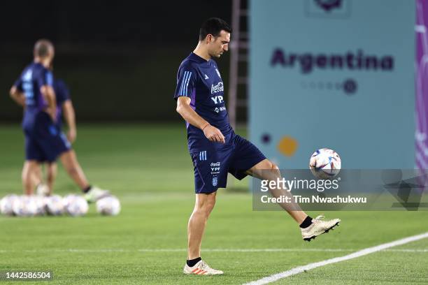 Lionel Scaloni, Head Coach of Argentina, juggles a ball on during the Argentina Training Session at Qatar University training site 3 on November 18,...