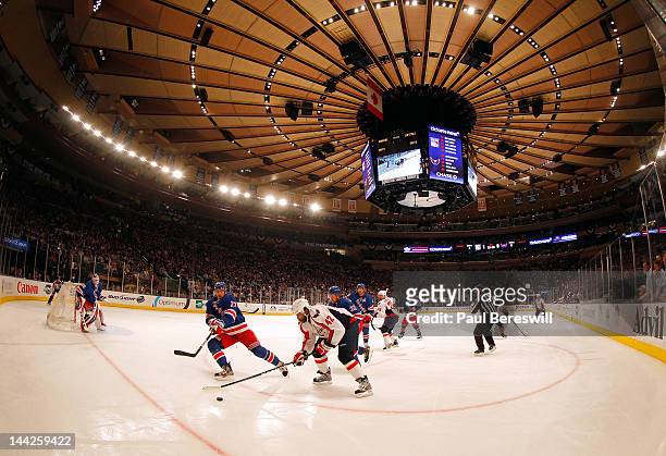 Ryan McDonagh of the New York Rangers fights for the puck in the first period against Joel Ward of the Washington Capitals in Game Seven of the...
