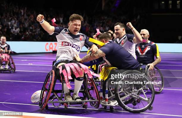 Tom Halliwell of England celebrates their sides fifth try during the Wheelchair Rugby League World Cup Final match between France and England at...
