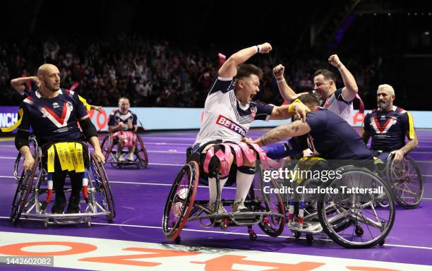 Tom Halliwell of England celebrates their sides fifth try during the Wheelchair Rugby League World Cup Final match between France and England at...