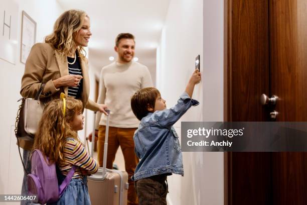 family in the hotel searching for the room - hotel room stock pictures, royalty-free photos & images